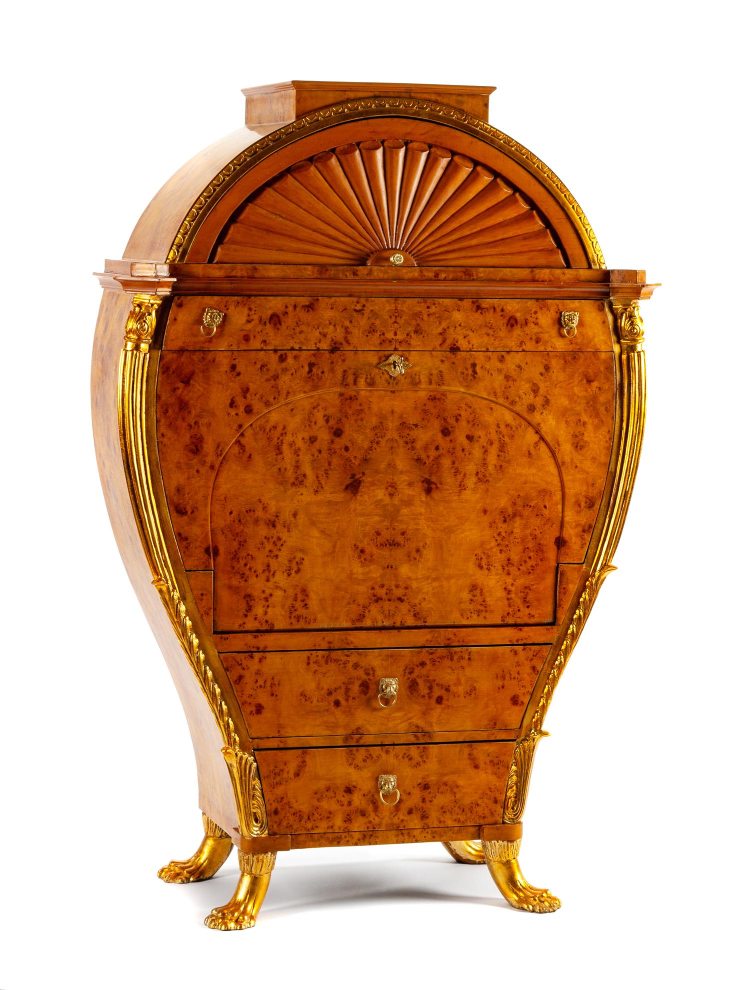 An Austrian Biedermeier Parcel Gilt Secretary Height 64 x width 43 1/2 x depth 18 inches.