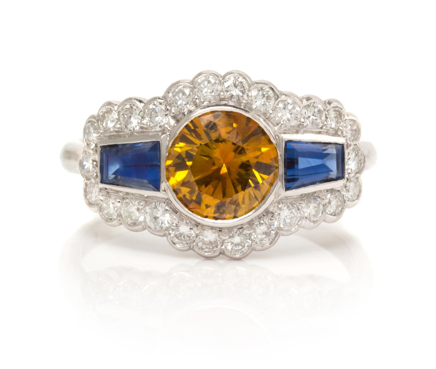 An 18 Karat White Gold, Colored Diamond, Sapphire and Diamond Ring, 2.70 dwts.