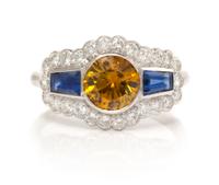 An 18 Karat White Gold, Colored Diamond, Sapphire and Diamond Ring, 2.70 dwts.