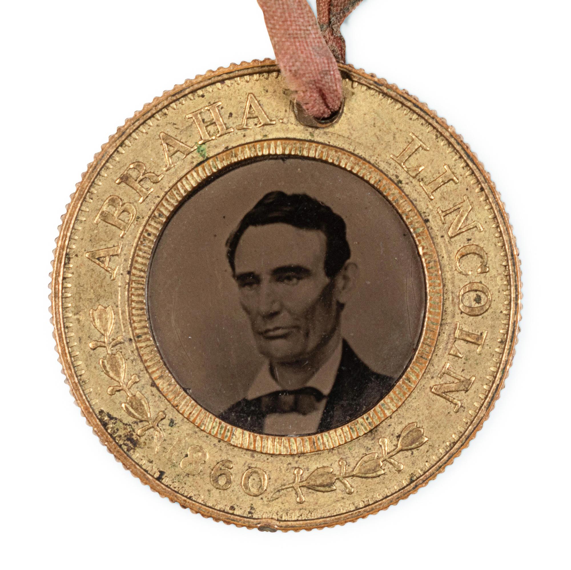 [LINCOLN-HAMLIN CAMPAIGN]. A presidential campaign token featuring ferrotype portraits of Lincoln and Hamlin, ca. 1860.