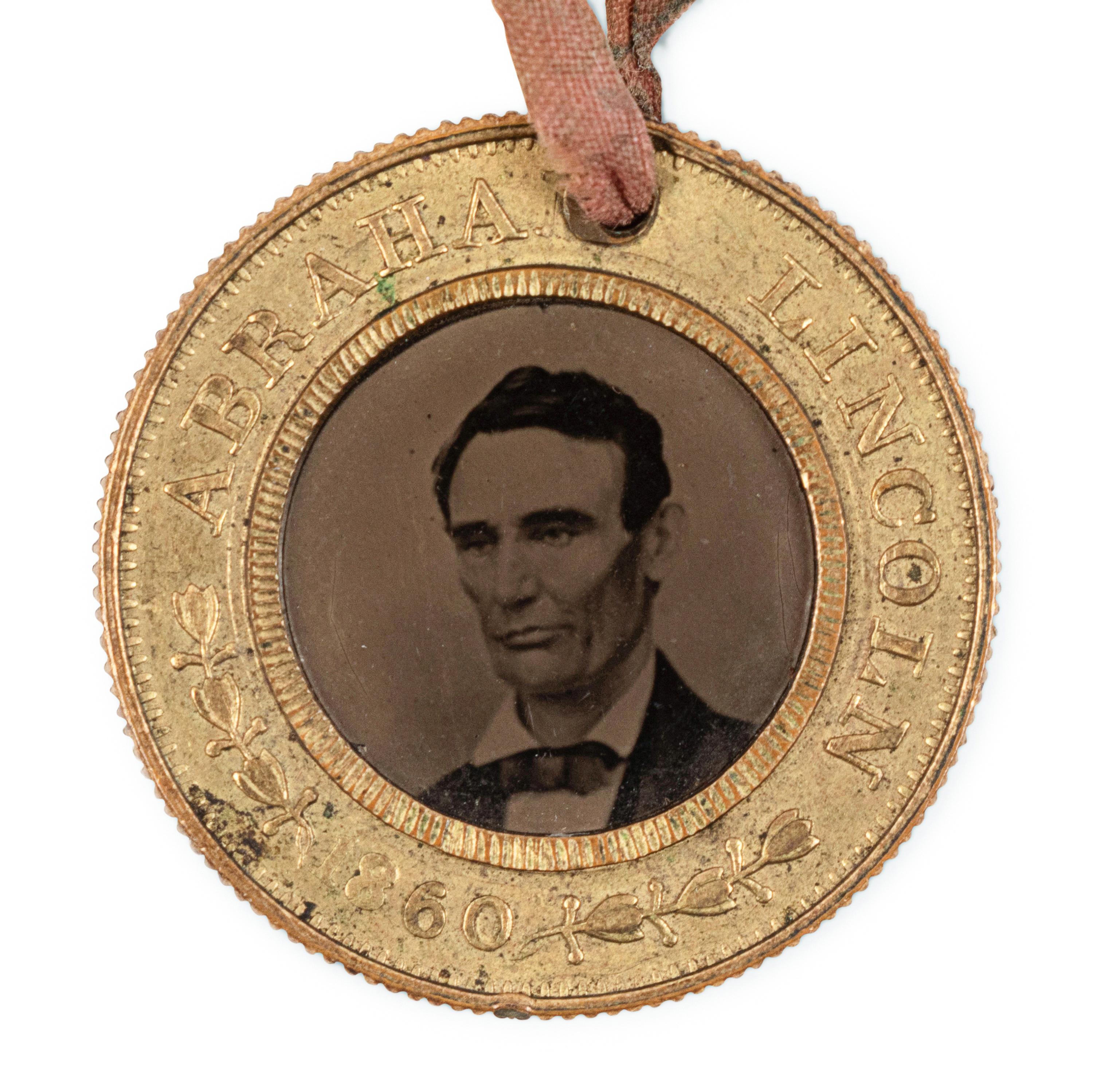 [LINCOLN-HAMLIN CAMPAIGN]. A presidential campaign token featuring ferrotype portraits of Lincoln and Hamlin, ca. 1860.