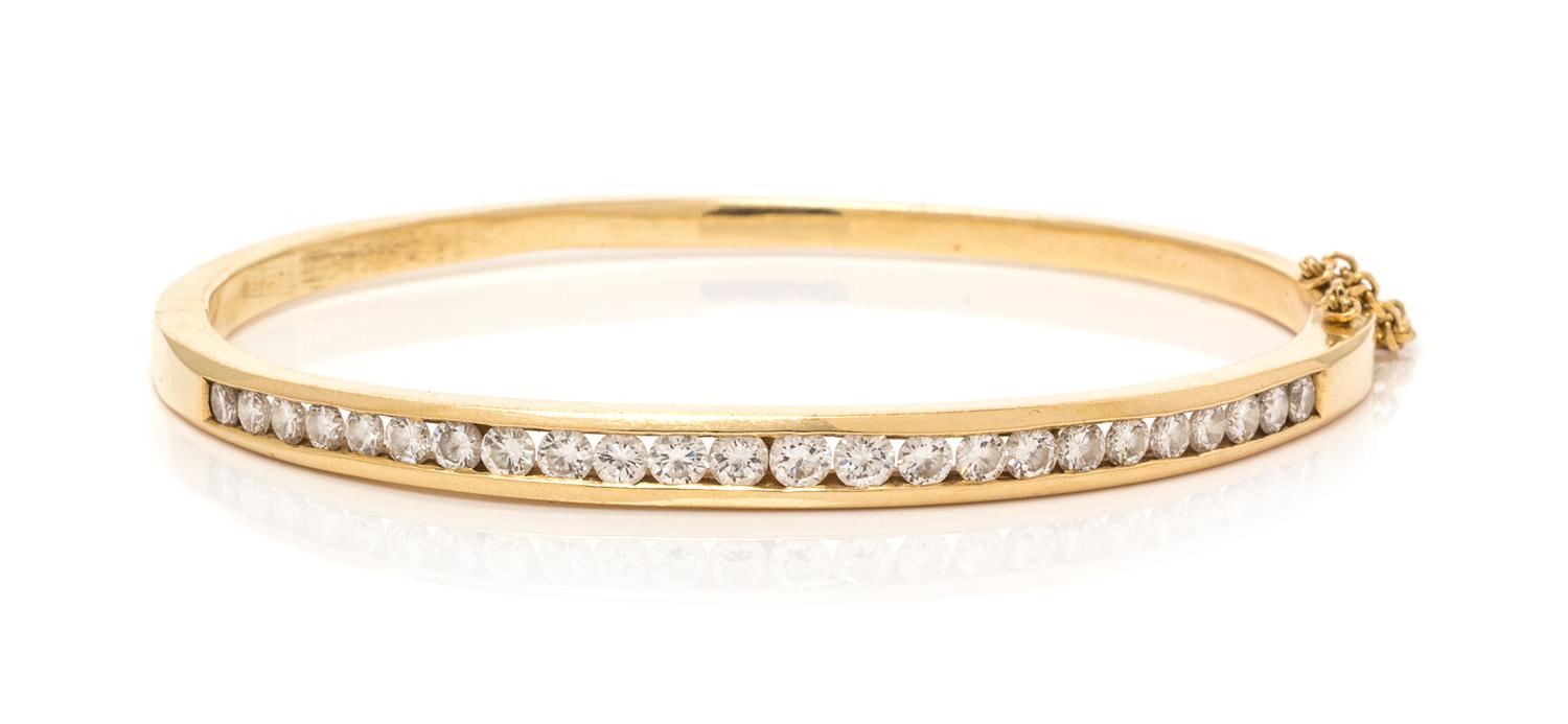A 14 Karat Yellow Gold and Diamond Bangle Bracelet,