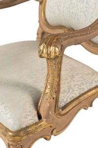 A Pair of Italian Rococo Painted and Parcel Gilt Armchairs