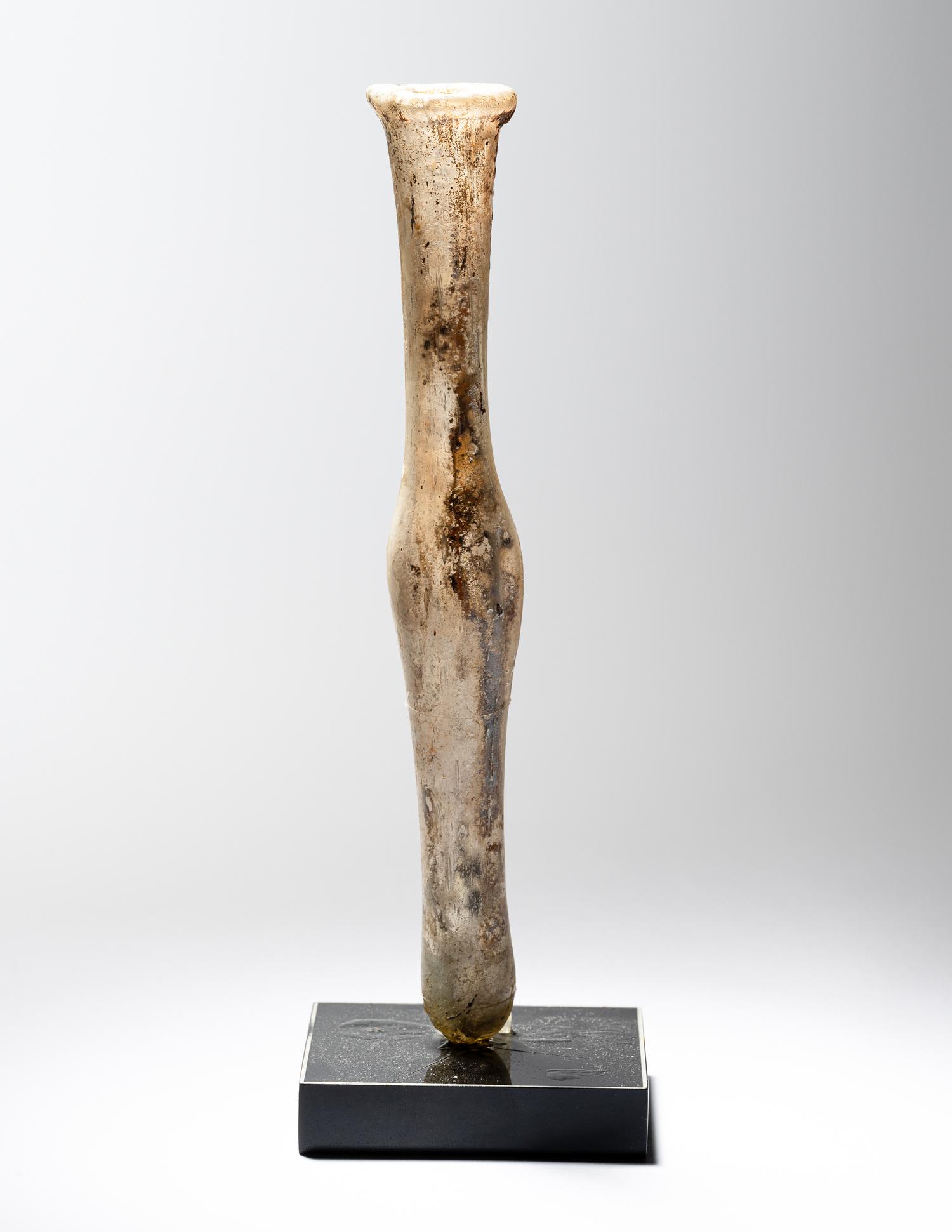 A Roman Pale Yellow Glass Unguentarium