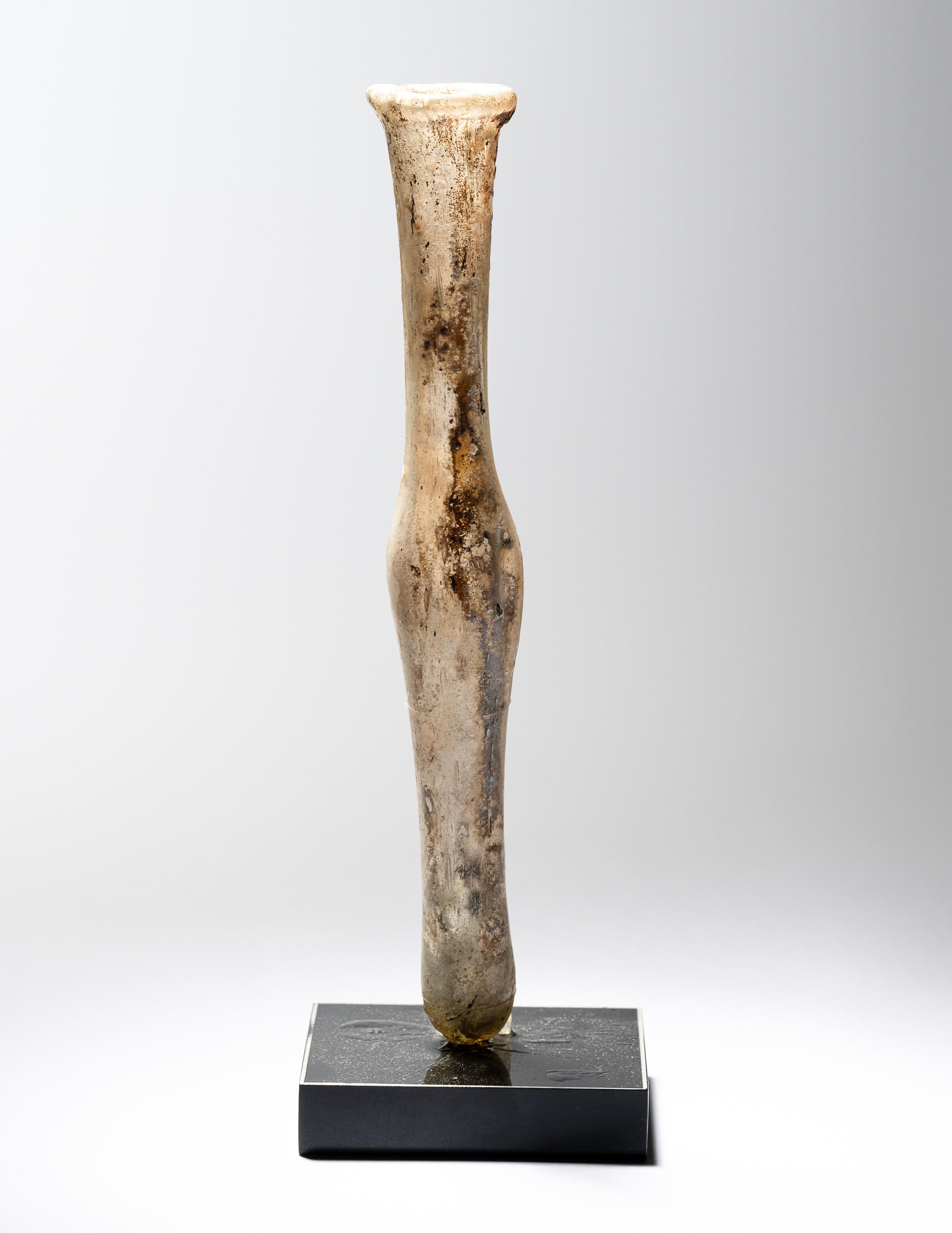 A Roman Pale Yellow Glass Unguentarium