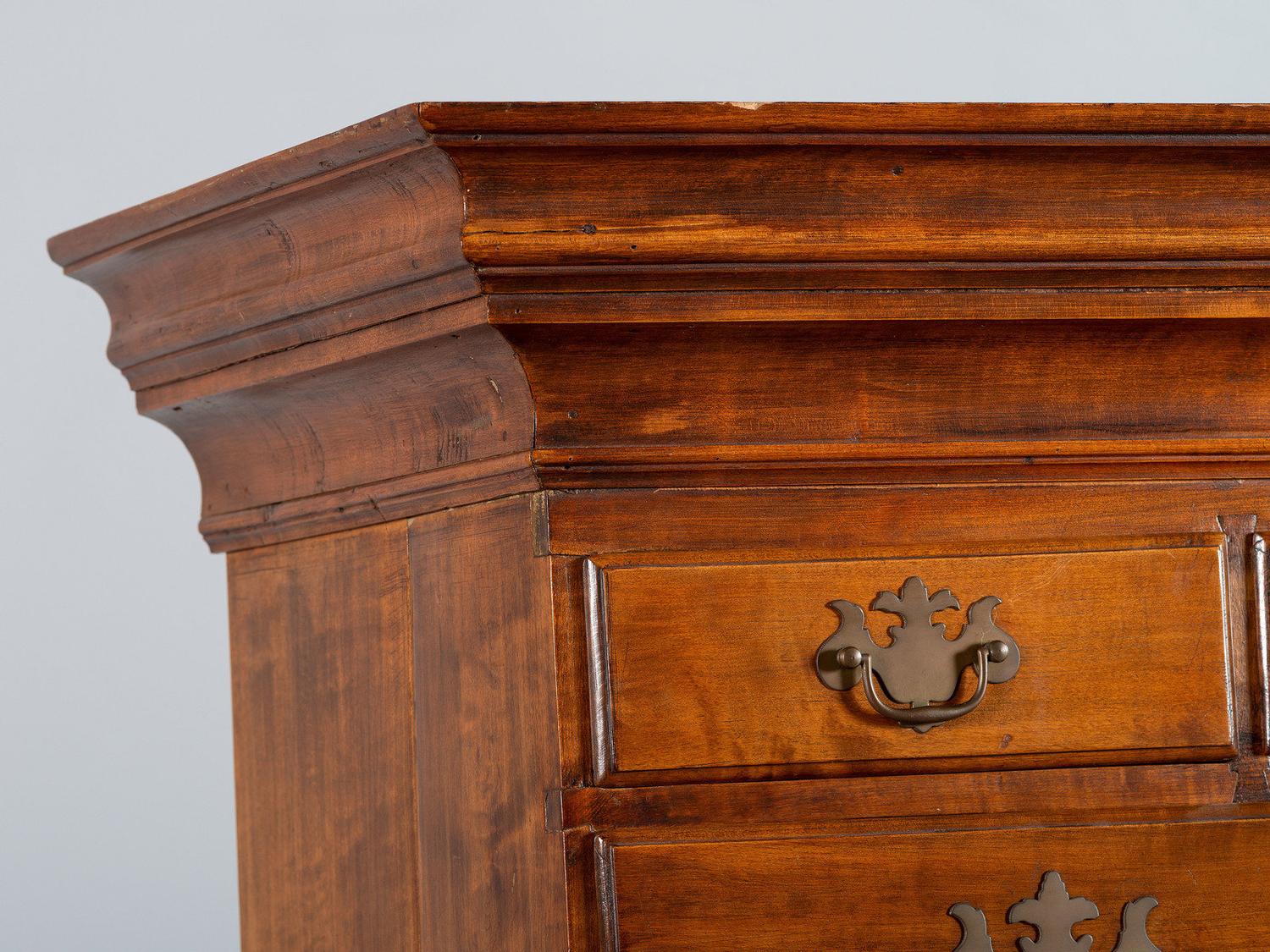 A Queen Anne Shell-Carved and Figured Maple Flat-Top High Chest of Drawers