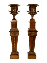 A Pair of George III Style Carved and Stained Wood Campana Urns on Pedestal Stands — 20TH CENTURY