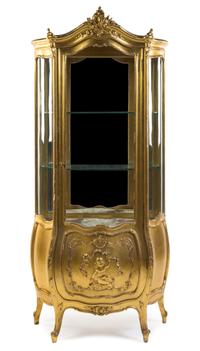 A Louis XV Style Giltwood Vitrine Height 70 3/8 x width 32 1/2 x depth 17 1/2 inches.
