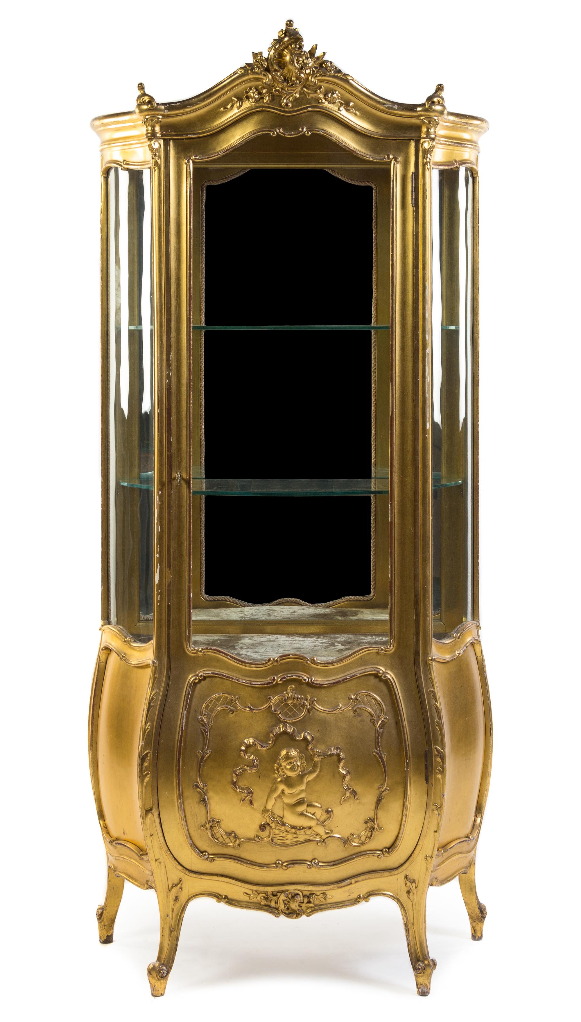 A Louis XV Style Giltwood Vitrine Height 70 3/8 x width 32 1/2 x depth 17 1/2 inches.
