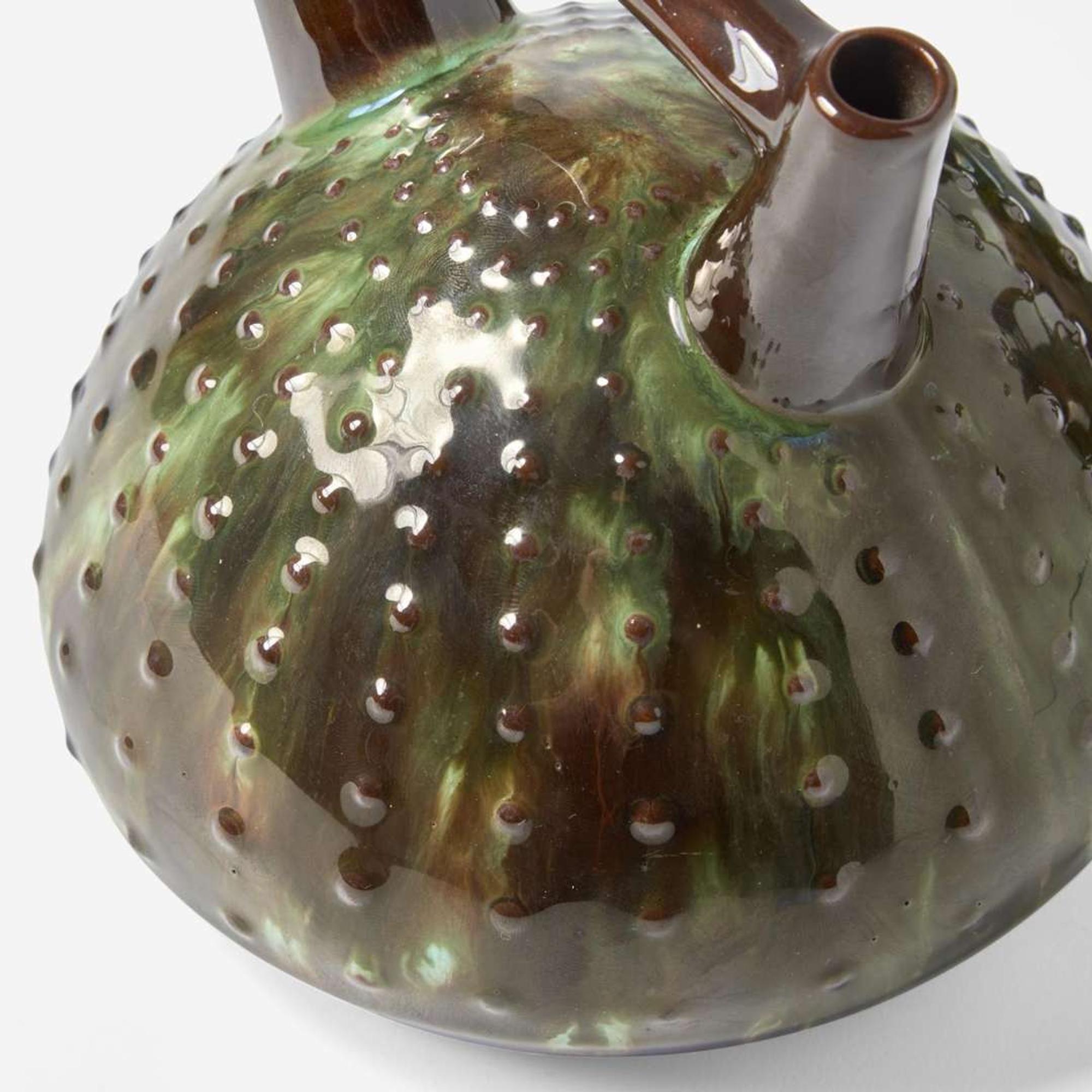 Three glazed earthenware jugs Christopher Dresser (English, 1834-1904), Ault Pottery (1887-1922) and Linthorpe Pottery Works (1879-1889), England, circa 1890 and 1879-1882 respectively