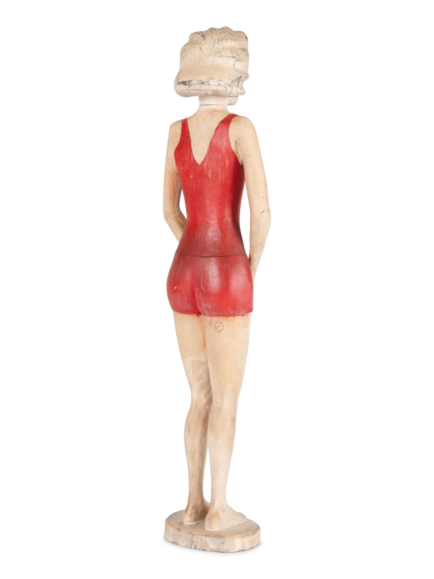 A Carved and Painted Wood Figure of a Bather