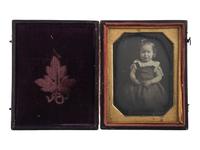 [EARLY PHOTOGRAPHY]. Quarter plate daguerreotype of sweet young girl with CDVs of men, women, and children from Woodstock Plantation. Baton Rouge, Louisiana.