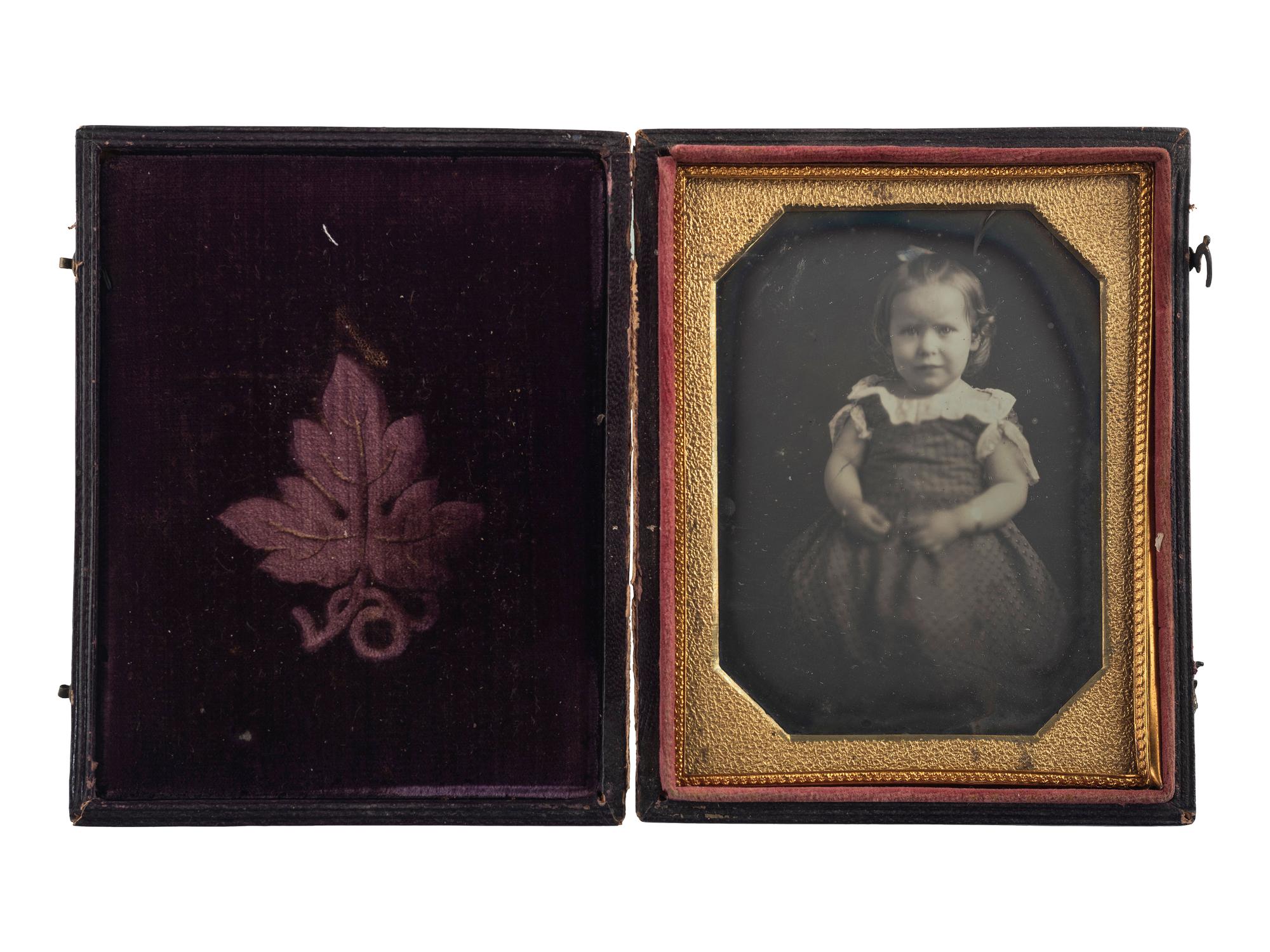 [EARLY PHOTOGRAPHY]. Quarter plate daguerreotype of sweet young girl with CDVs of men, women, and children from Woodstock Plantation. Baton Rouge, Louisiana.