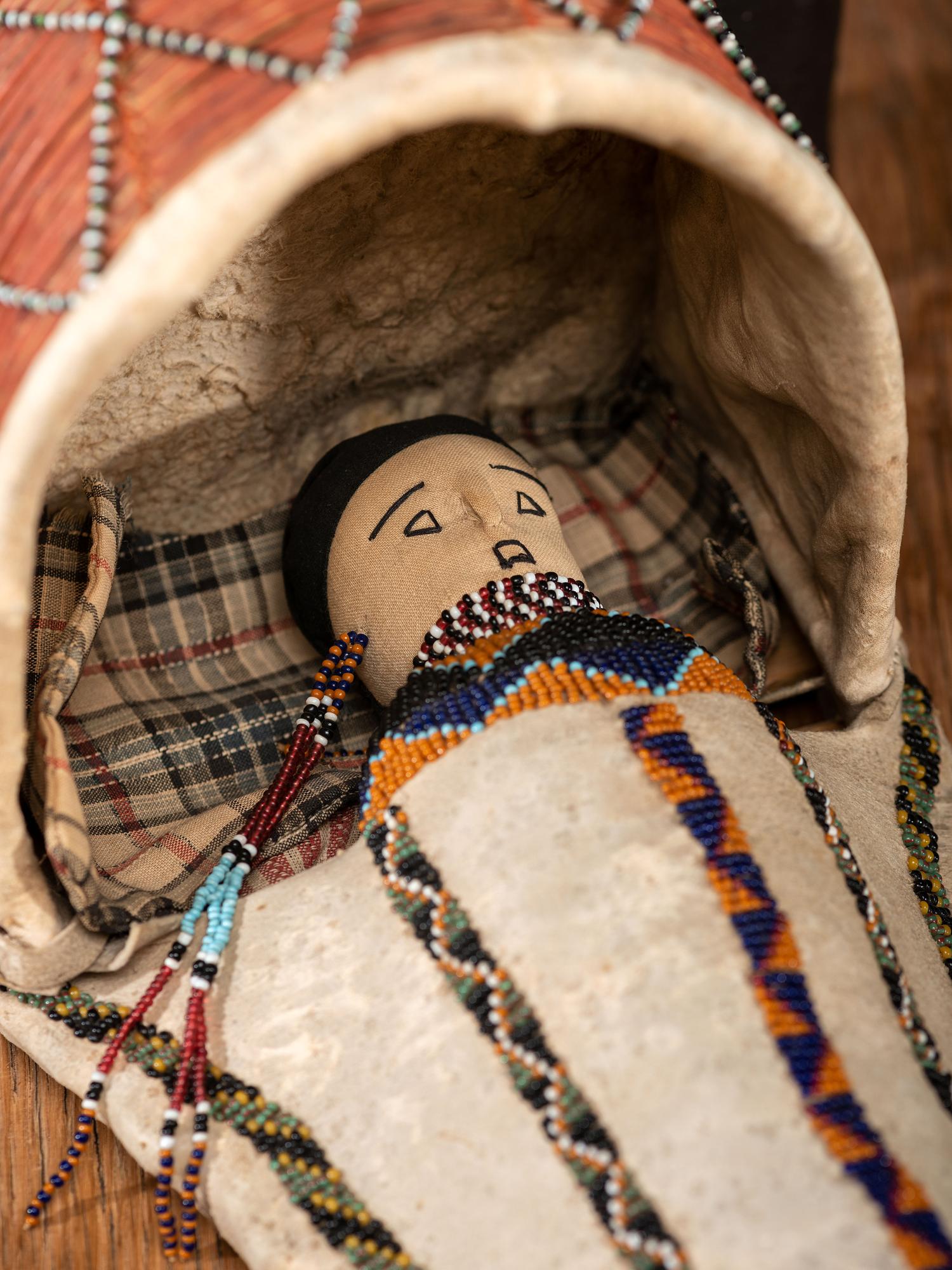 Apache Beaded Hide Cradle, with Doll