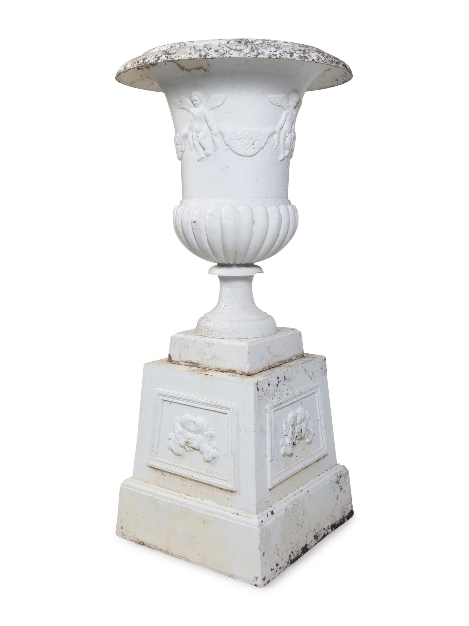 A Set of Four Victorian Style Painted Cast Iron Urns and Plinths