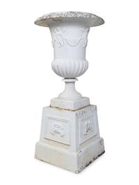 A Set of Four Victorian Style Painted Cast Iron Urns and Plinths