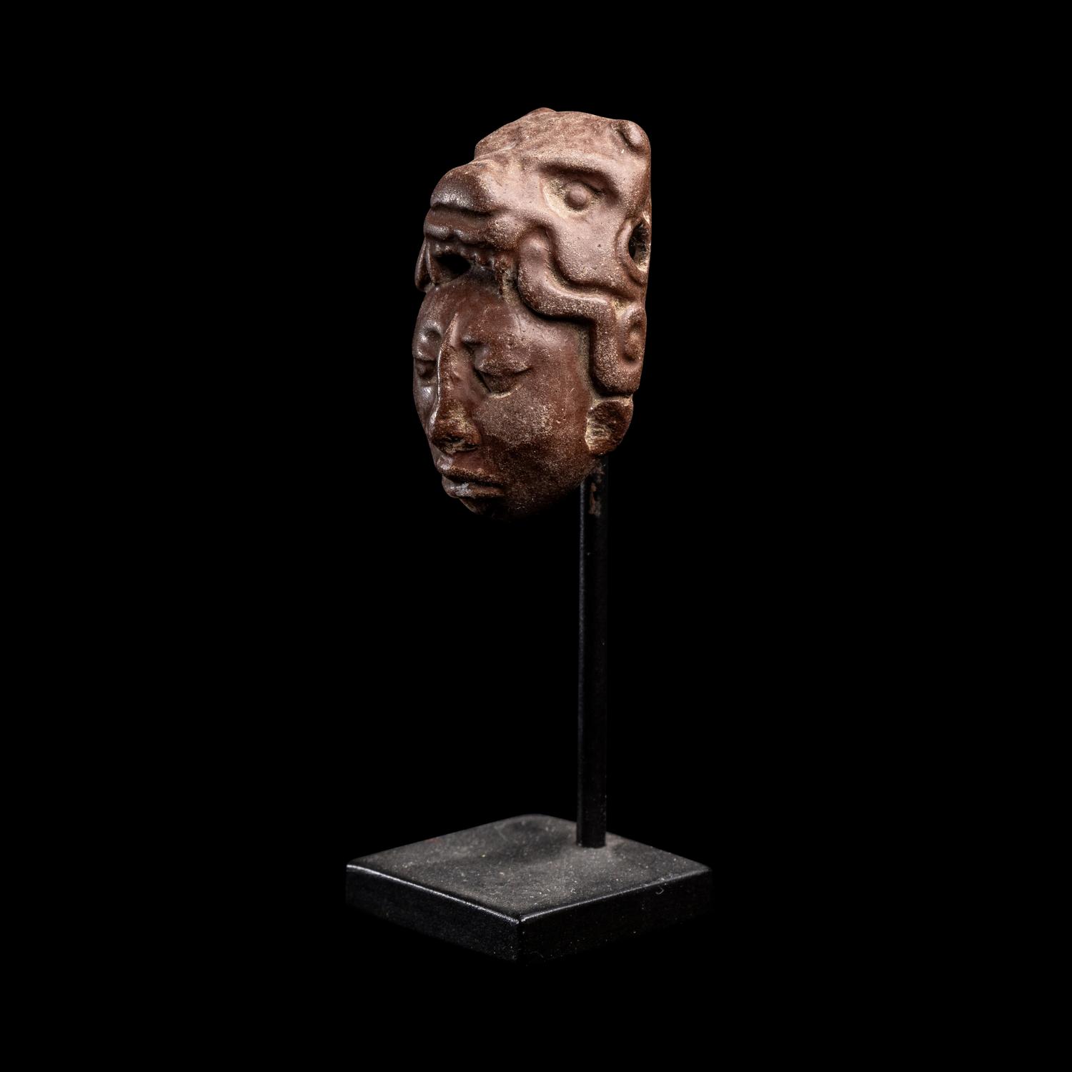A Maya Stone Head Pendant