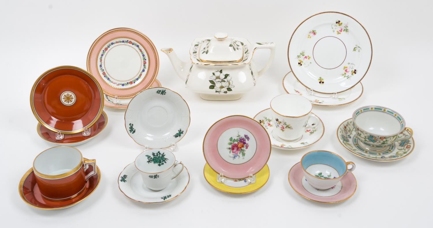 A Collection of Porcelain Cup and Saucer Sets Width of teapot over handle 10 inches. — 20TH CENTURY