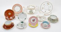 A Collection of Porcelain Cup and Saucer Sets Width of teapot over handle 10 inches. — 20TH CENTURY
