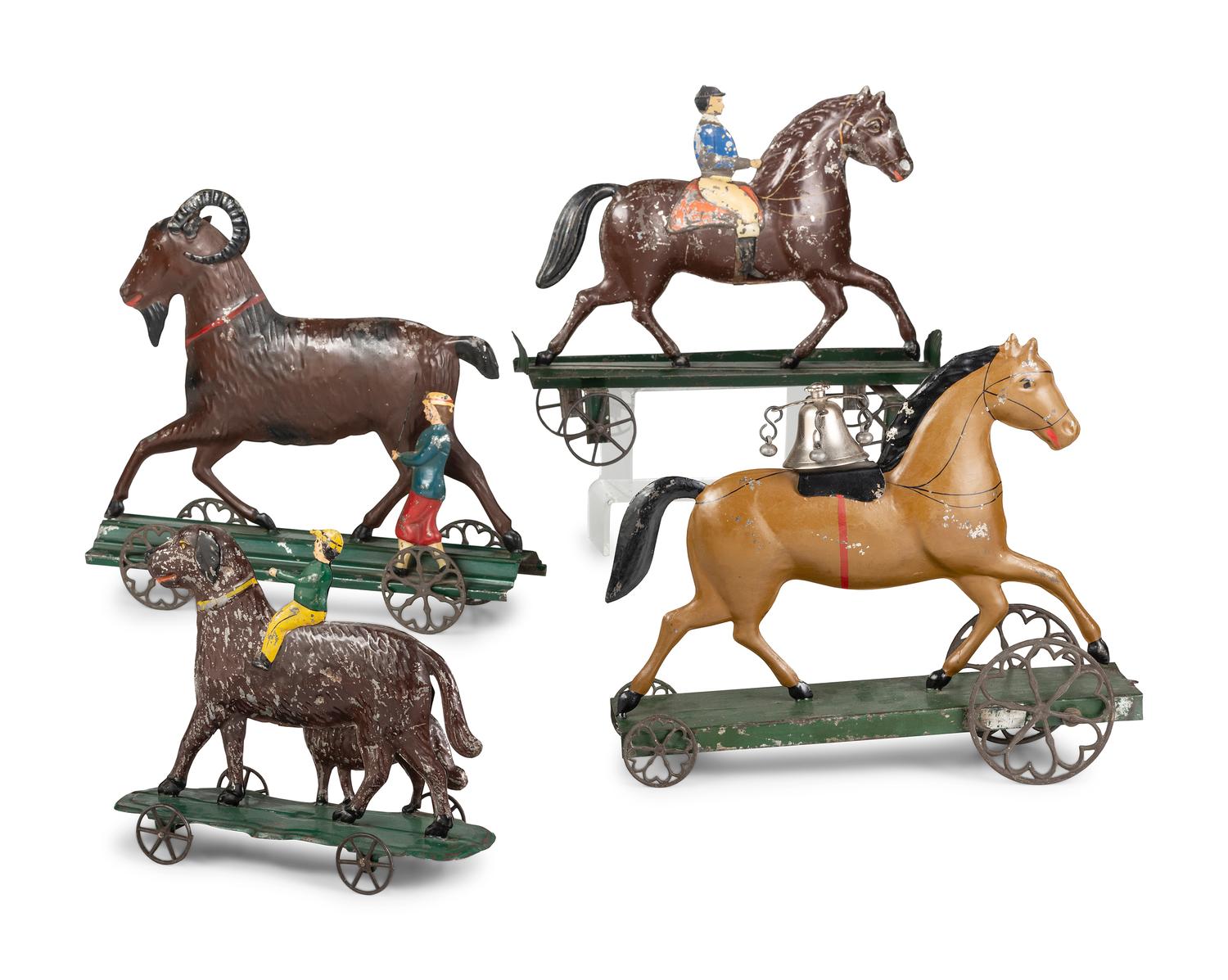 Four Pressed and Painted Tin Figural Pull Toys