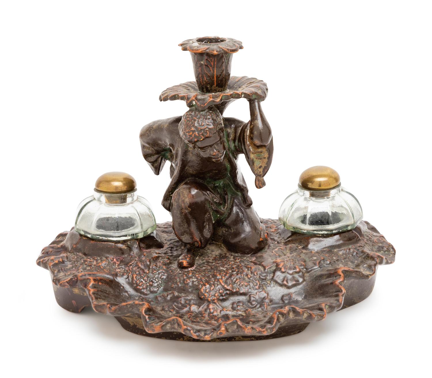 A Glazed Terra Cotta Figural Inkwell