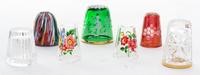 A Group of Seven Colored and Cut Glass Thimbles Height of largest 1 1/8 inches.