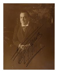 CARUSO, Enrico (1873-1921). Sepia photographic portrait signed (“Enrico Caruso N.Y. 1909”).
