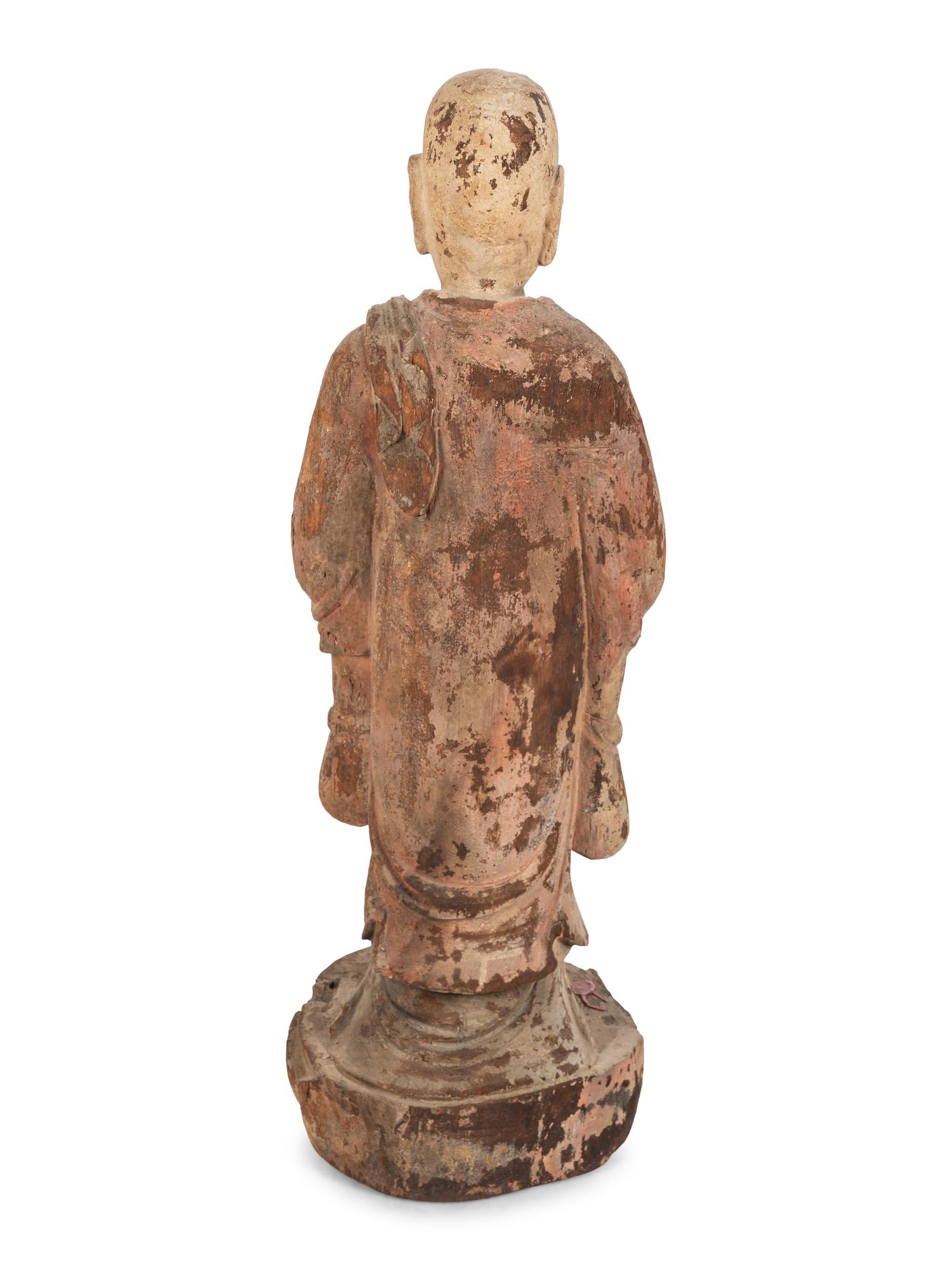 A Chinese Carved Wood Standing Figure with Polychrome Decoration