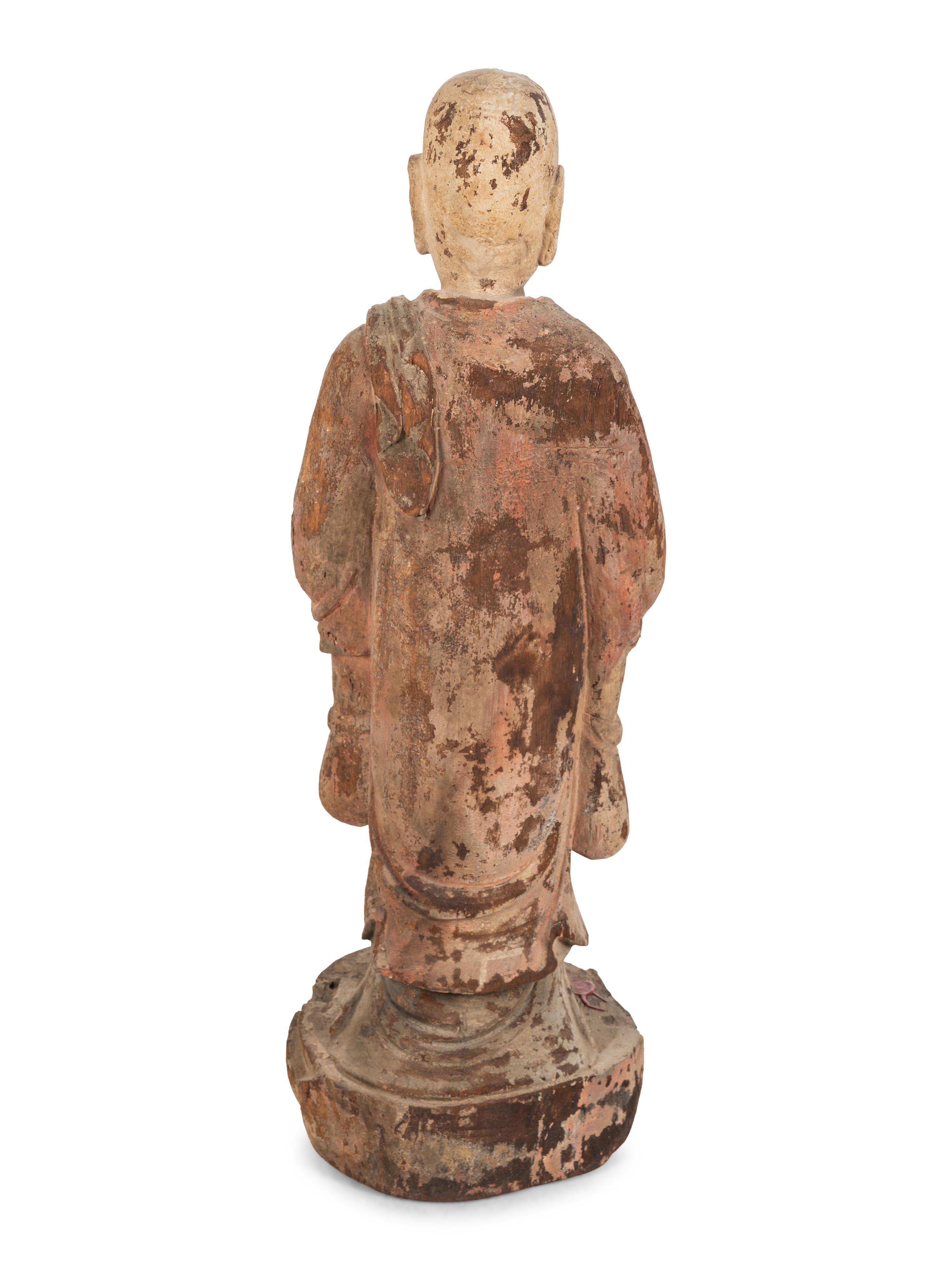 A Chinese Carved Wood Standing Figure with Polychrome Decoration