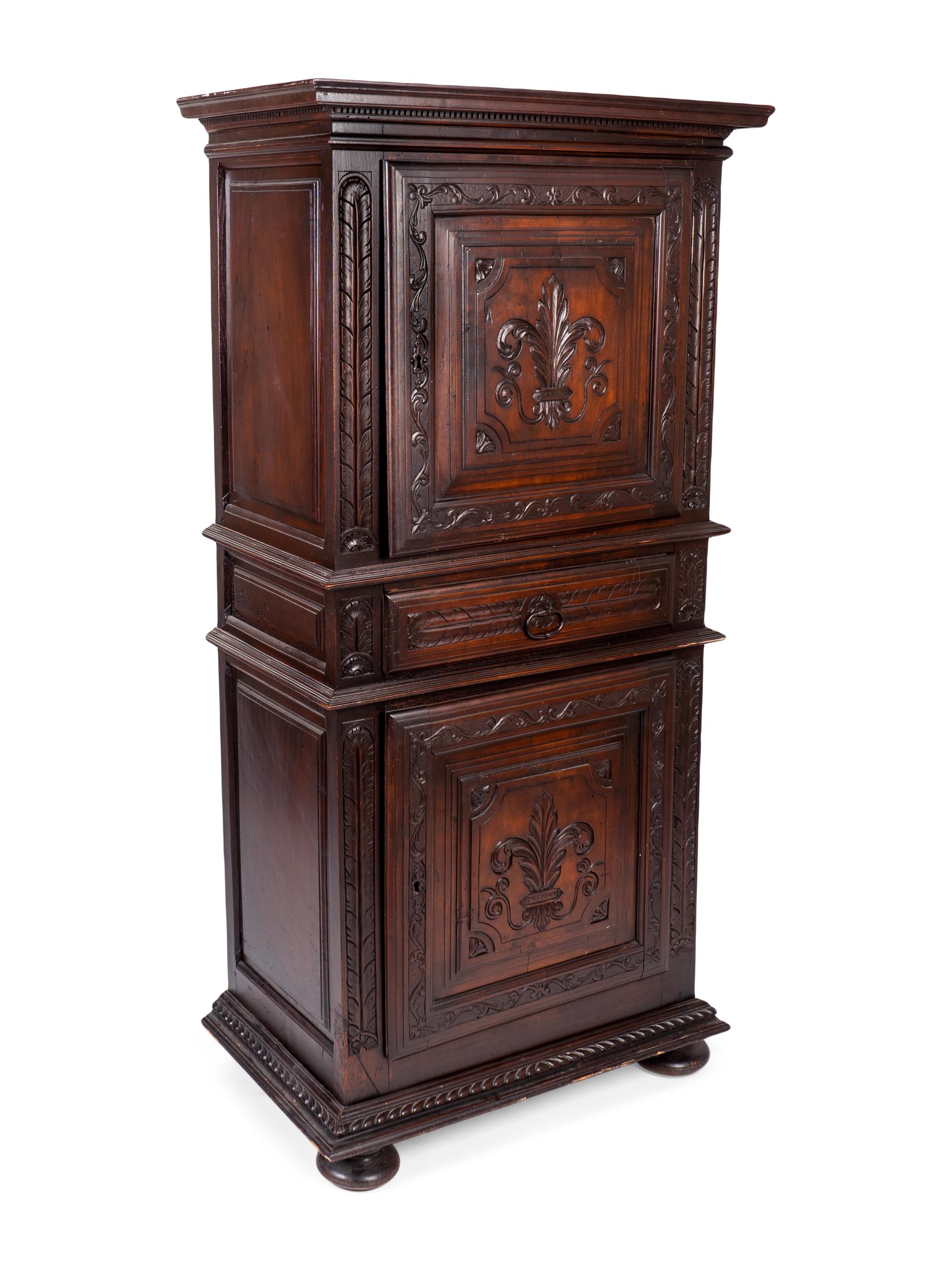 A Louis XIII Style Carved Walnut Cabinet