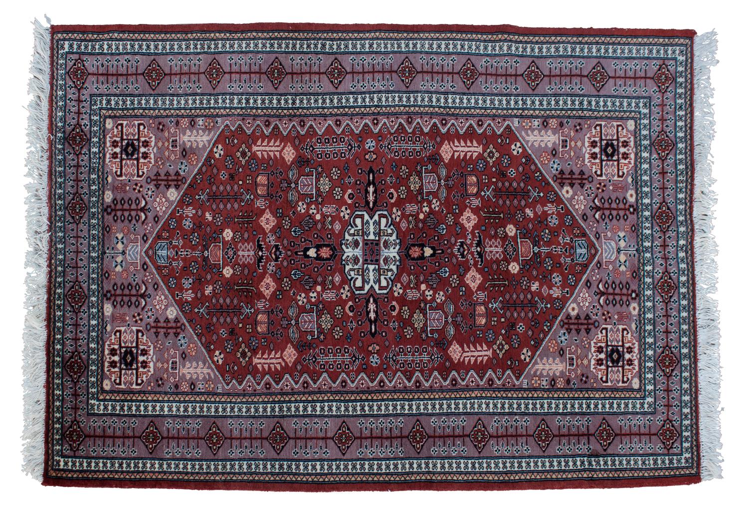 An Iranian Wool Rug 5 feet 10 inches x 4 feet 3 inches.