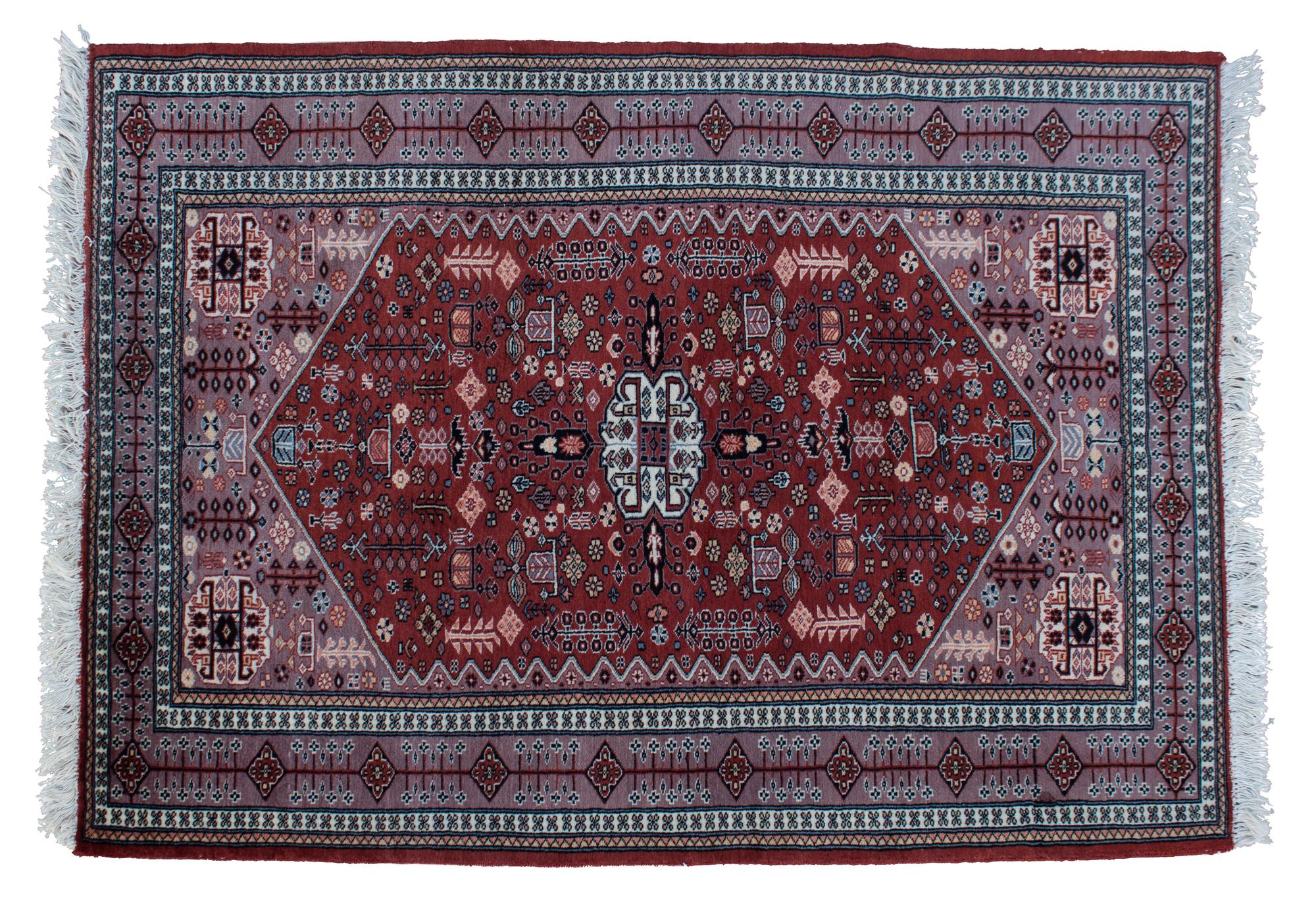 An Iranian Wool Rug 5 feet 10 inches x 4 feet 3 inches.