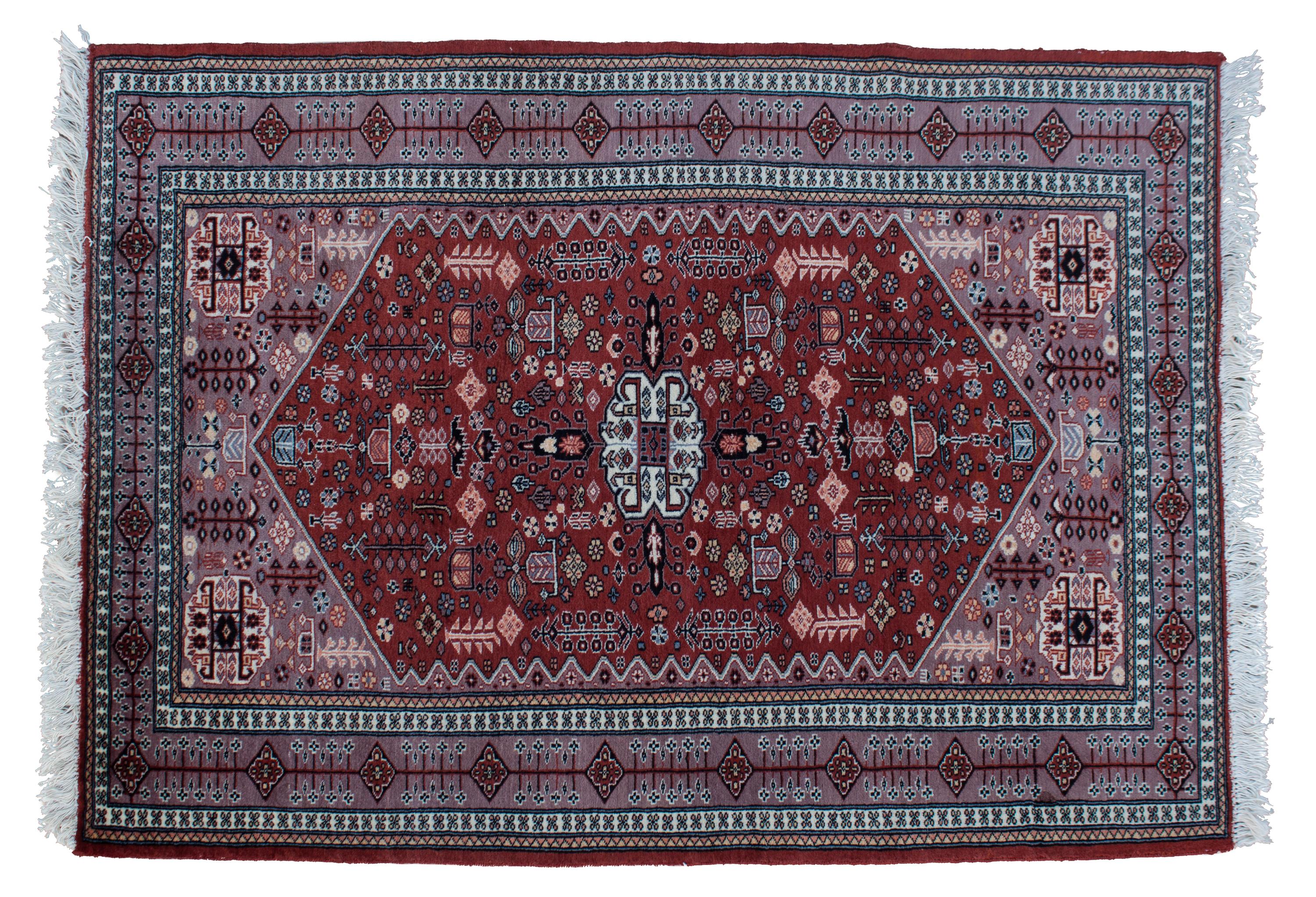 An Iranian Wool Rug 5 feet 10 inches x 4 feet 3 inches.