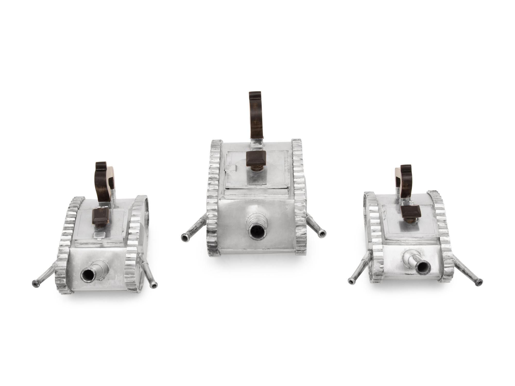 An American Silver Three-Piece Tea Service in the Form of Armored Tanks