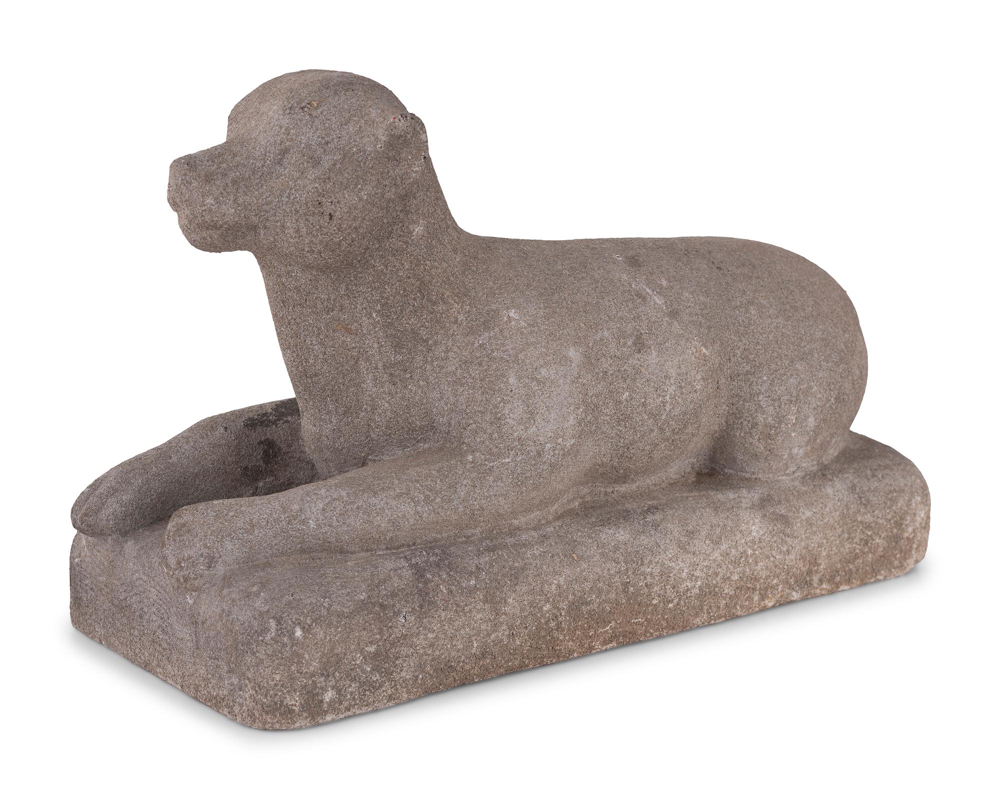 A Carved Stone Recumbent Dog, In the Manner of Edmondson