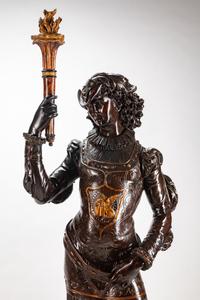 A Large Pair of English Parcel-Gilt and Stained Wood Figural Torchères on Stands