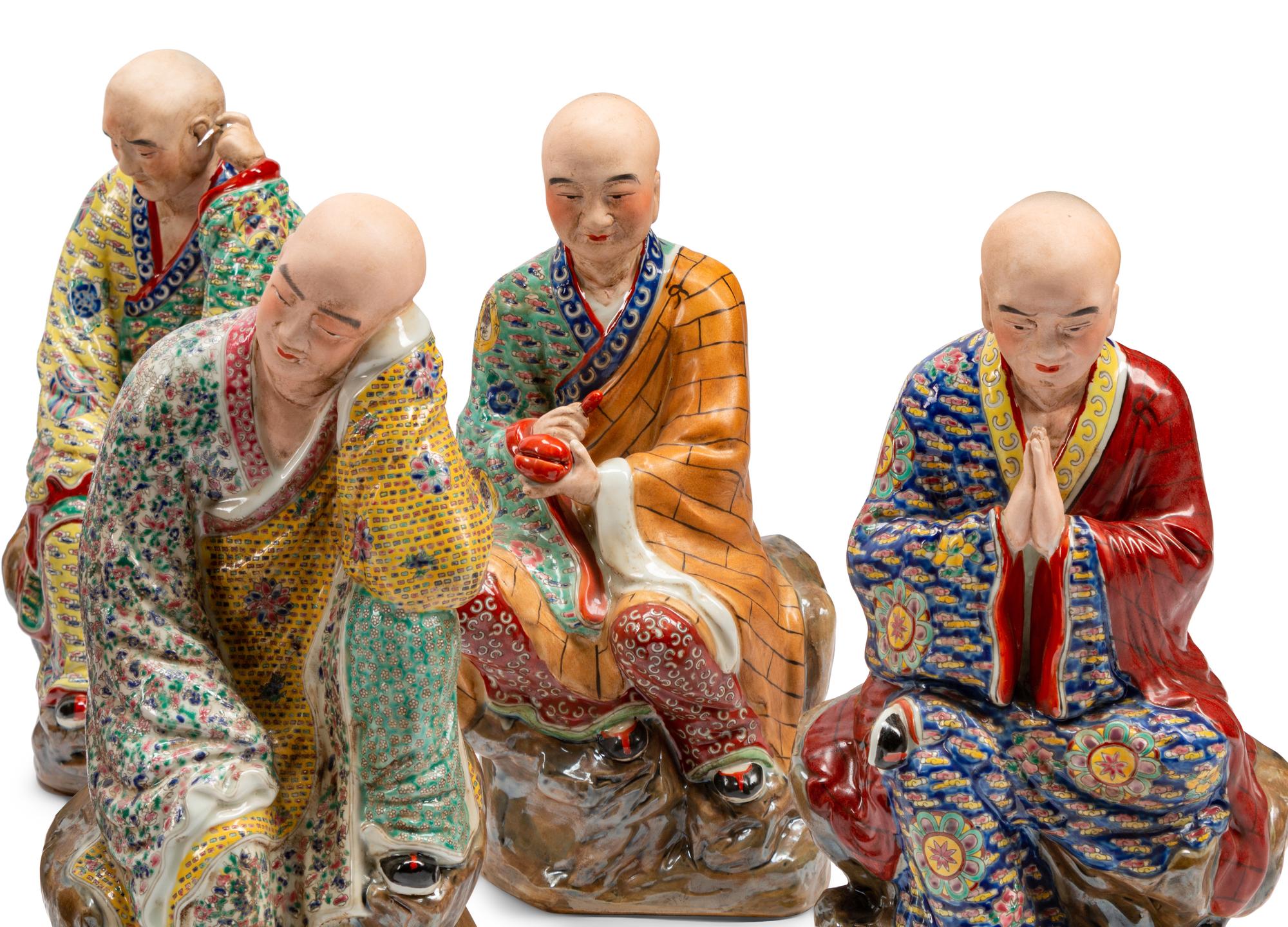 A Set of Eighteen Chinese Export Enameled Porcelain Figures of Immortals