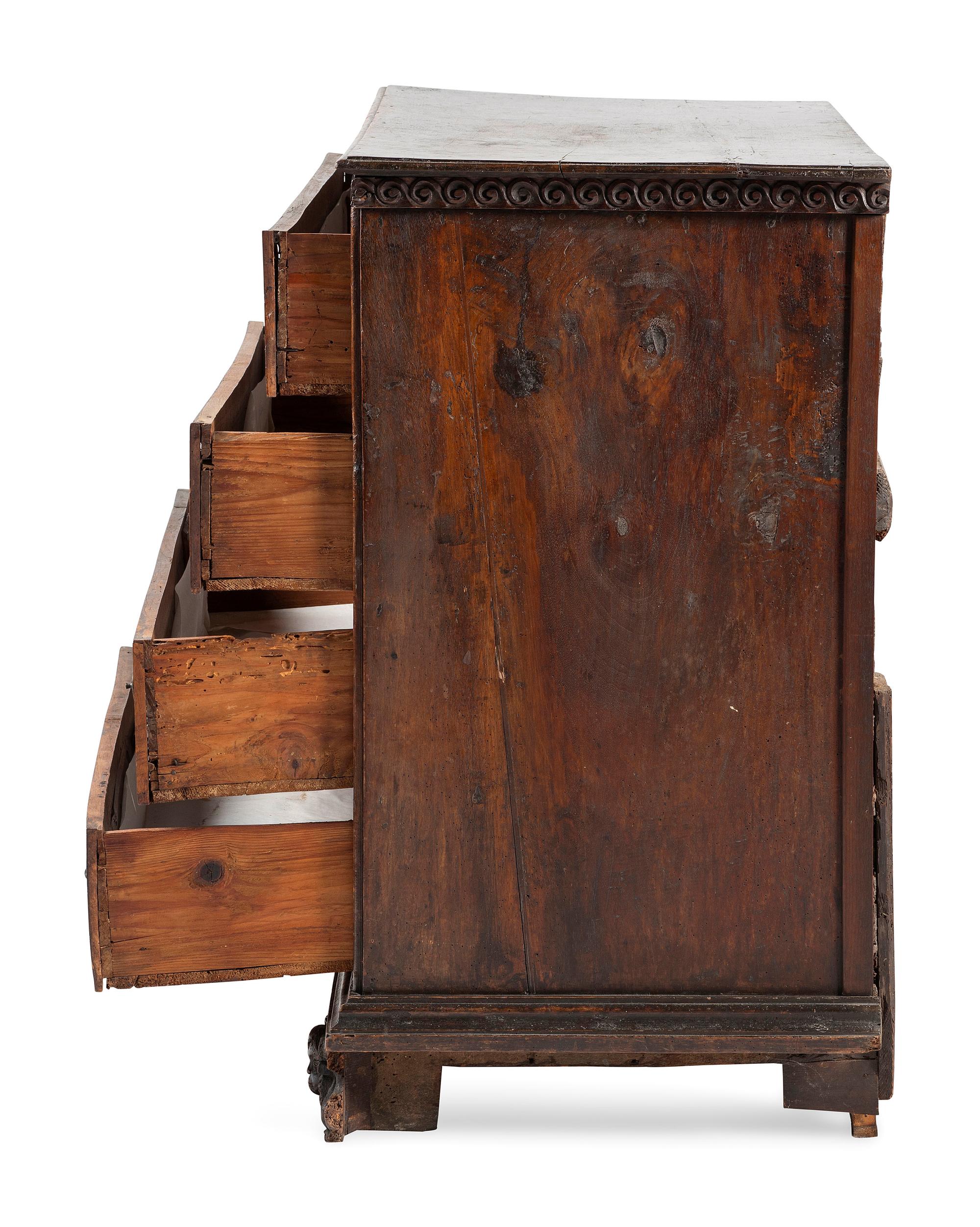 A Baroque Highly Carved Walnut Commode