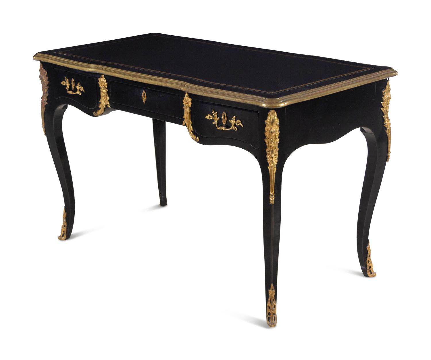 A Louis XV Style Gilt Metal Mounted Ebonized Bureau Plat