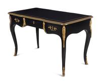 A Louis XV Style Gilt Metal Mounted Ebonized Bureau Plat