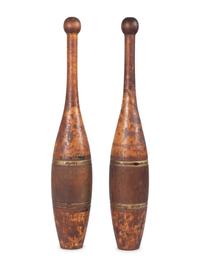 A Pair of Spalding 3Lb. Turned and Parcel Gilt Cherrywood Juggler's Pins