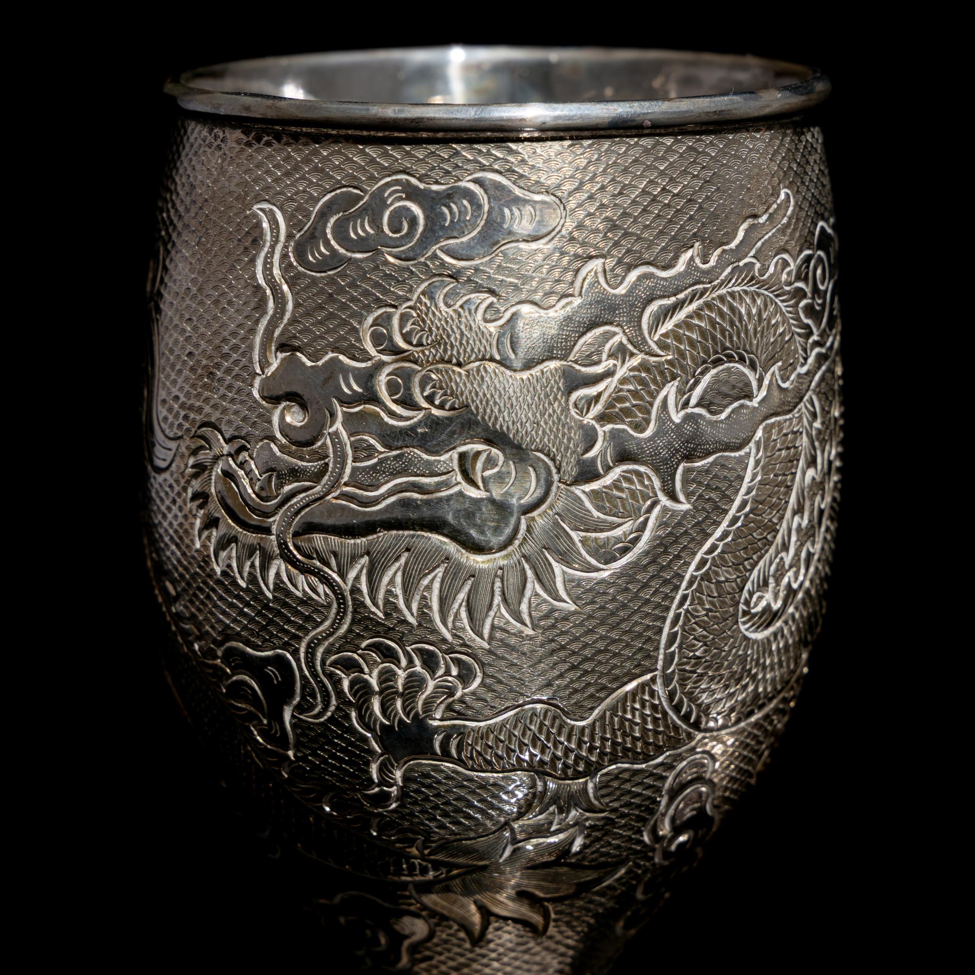 A Pair of Chinese Export Silver 'Dragon' Wine Cups, 20th Century 近代 外銷鏨云龍紋酒杯一對