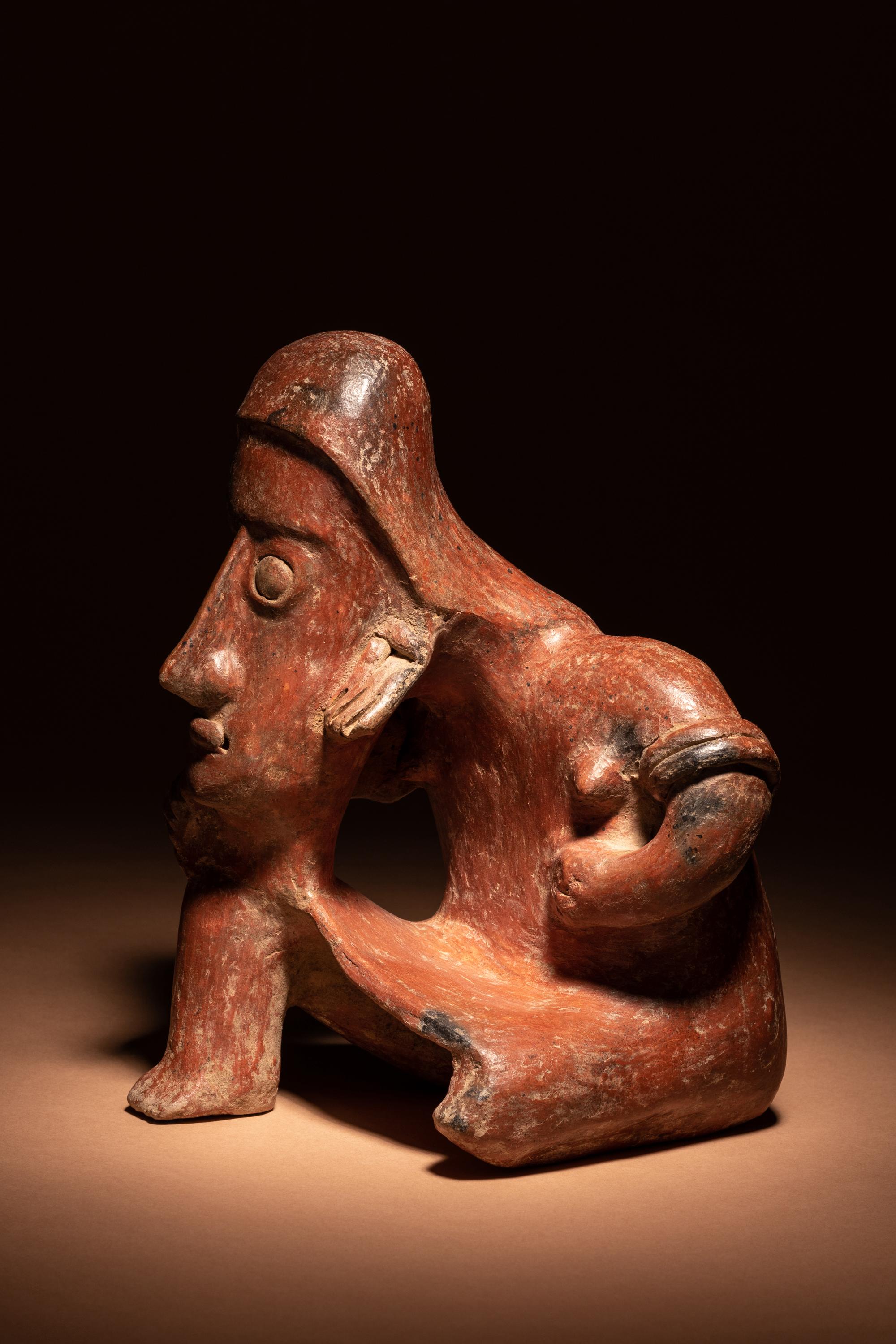 A Colima Terracotta Seated Male Figure