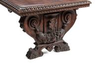 An Italian Renaissance Revival Carved Walnut Refectory Table