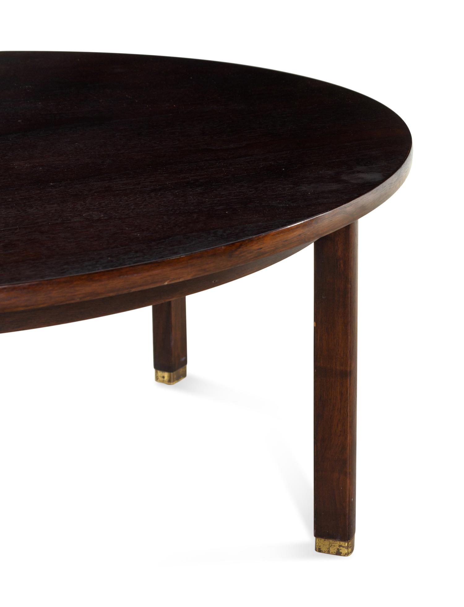 A Dunbar Lacquered and Brass Mounted Circular Low Table