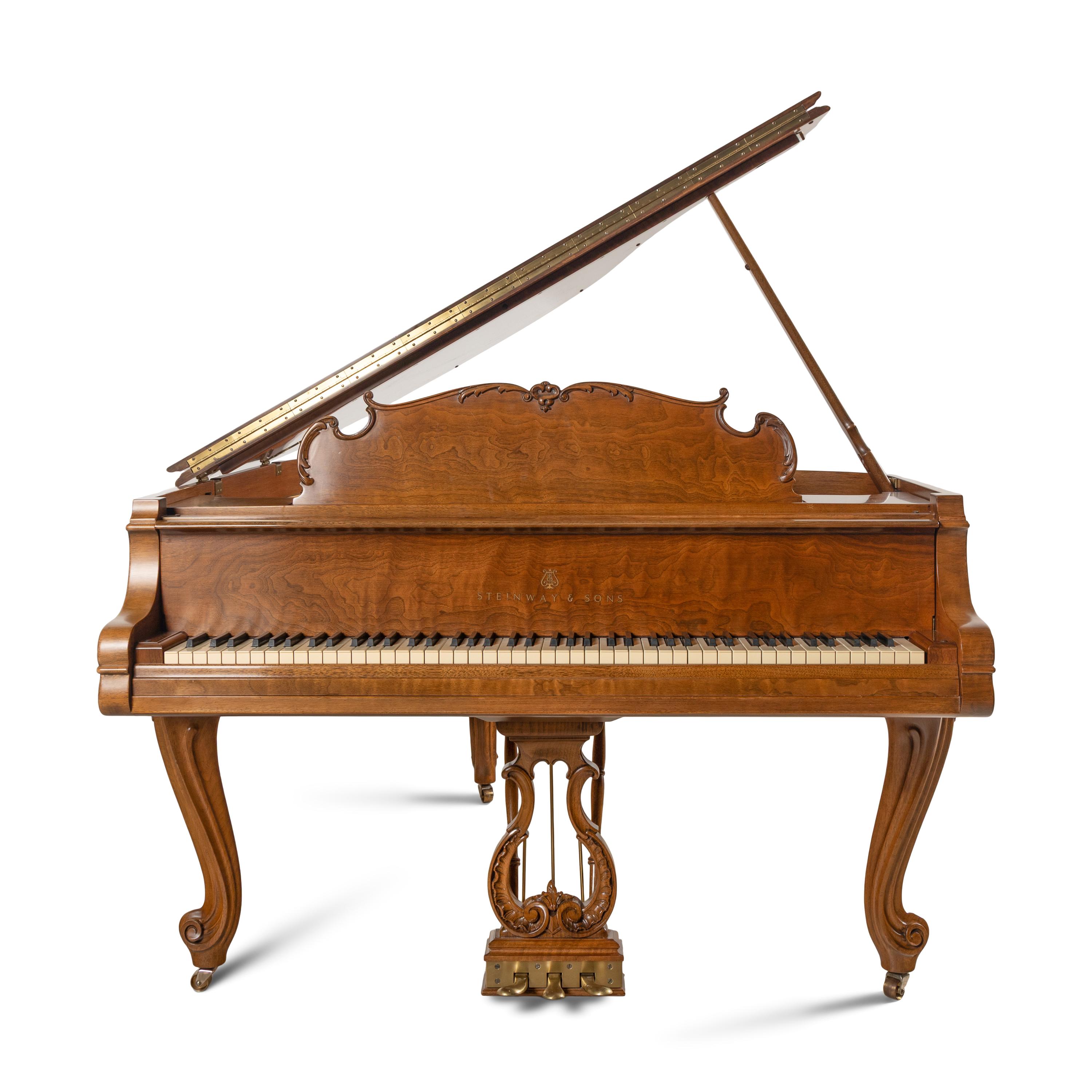 A Steinway and Sons Walnut Grand Piano