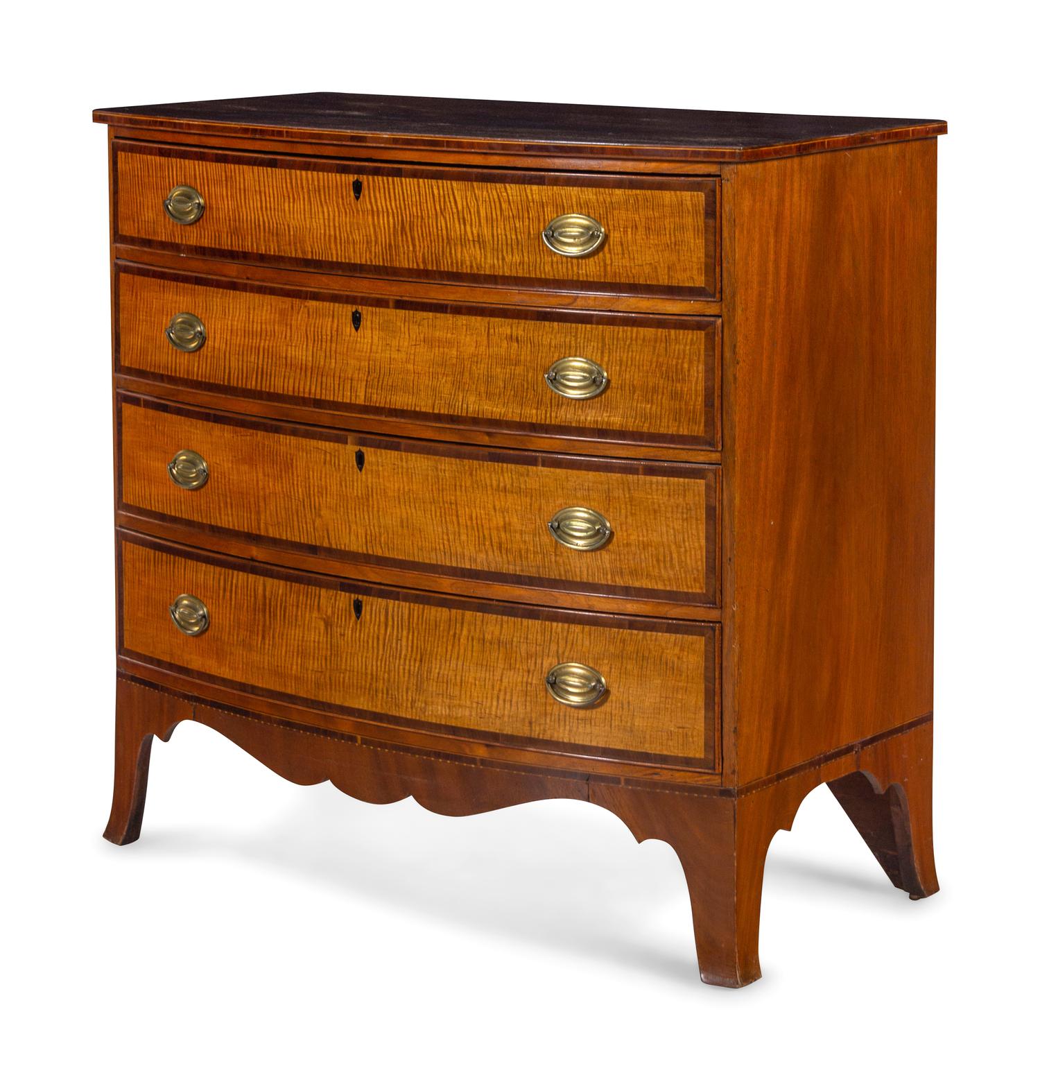 A Federal Tiger Maple and Mahogany Bow Front Chest of Drawers