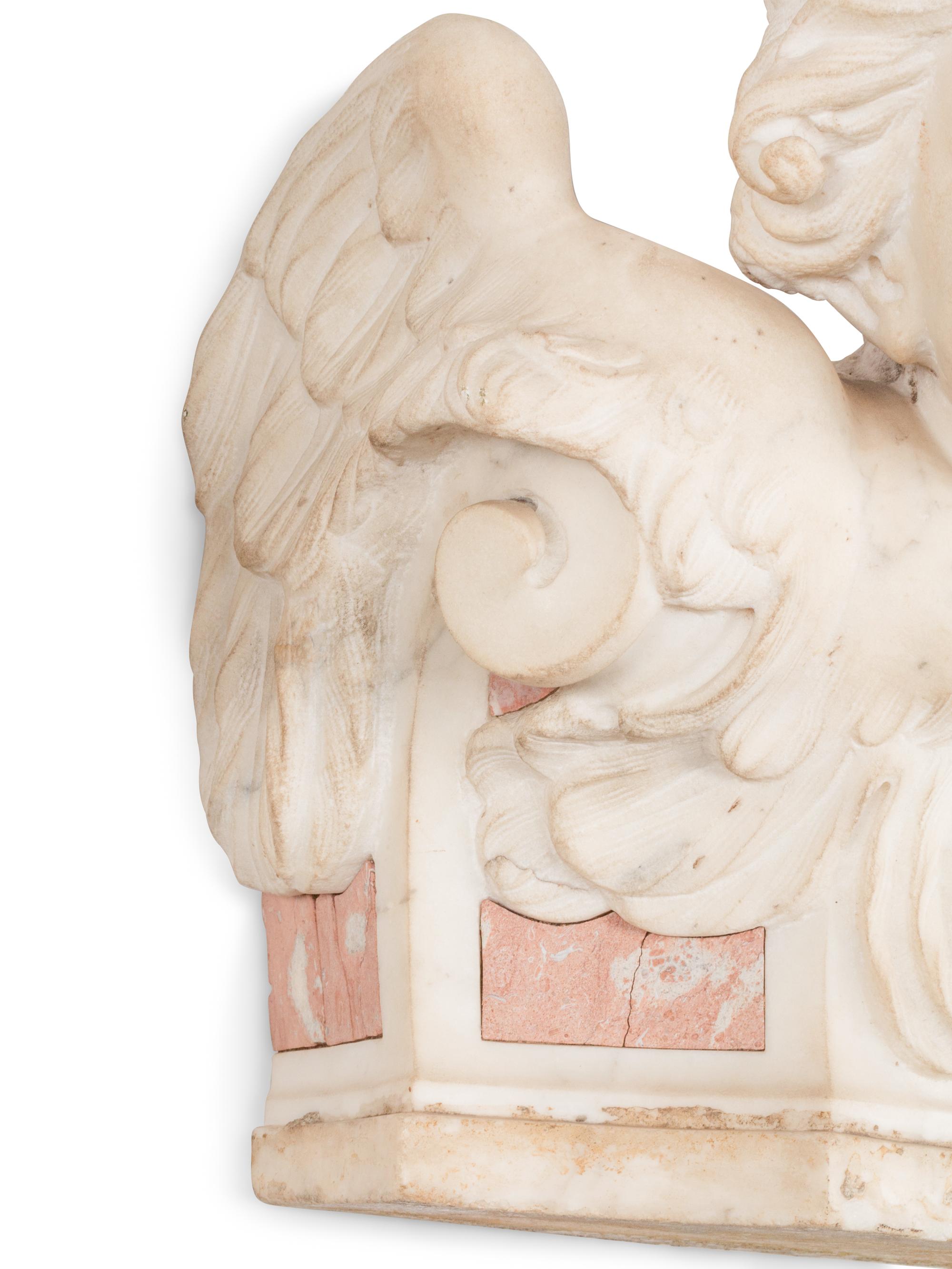 A Pair of Italian Carved Marble Figural Corbel Capitals