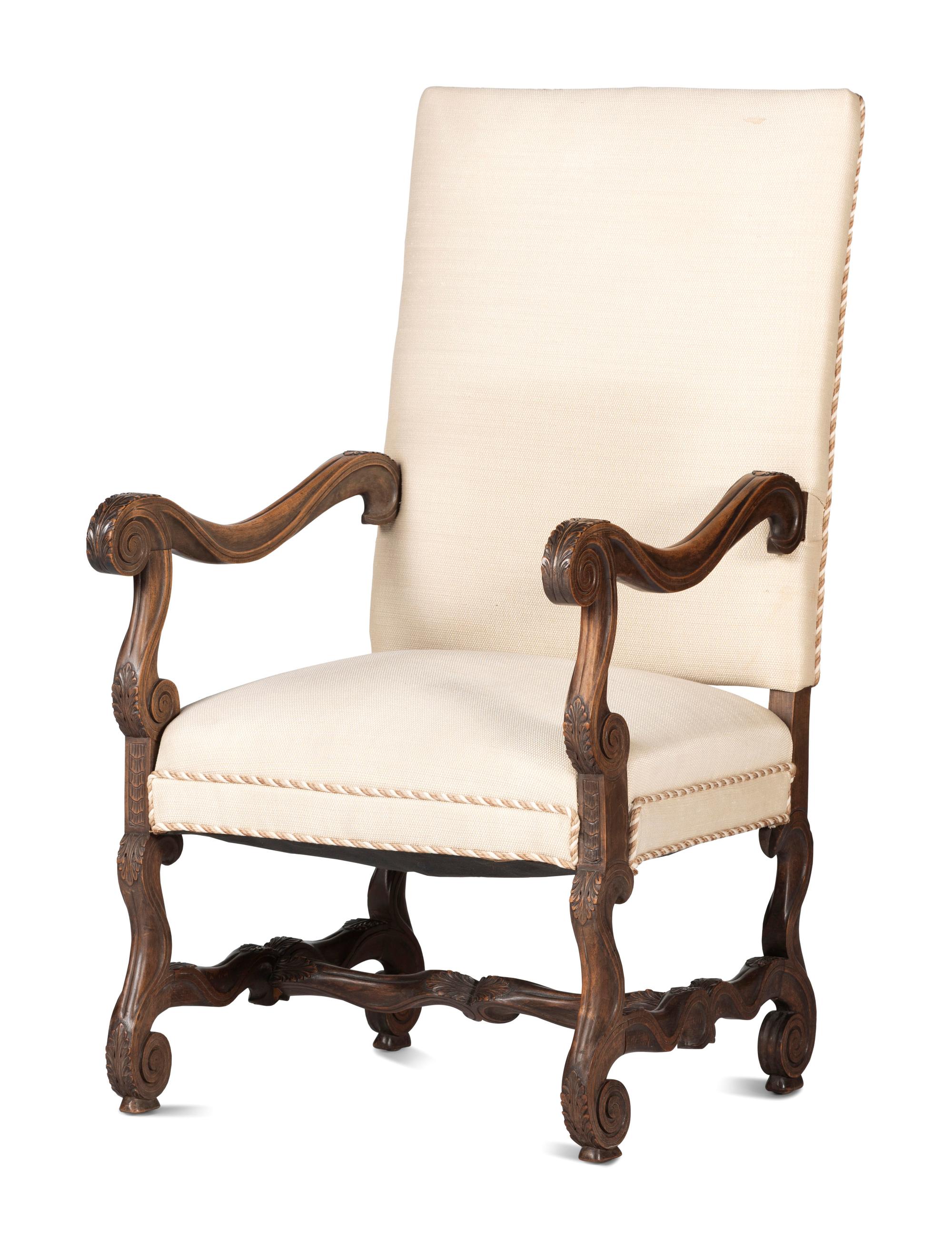 A Louis XIV Style Foliate and Scroll Carved Walnut Upholstered Fauteuil