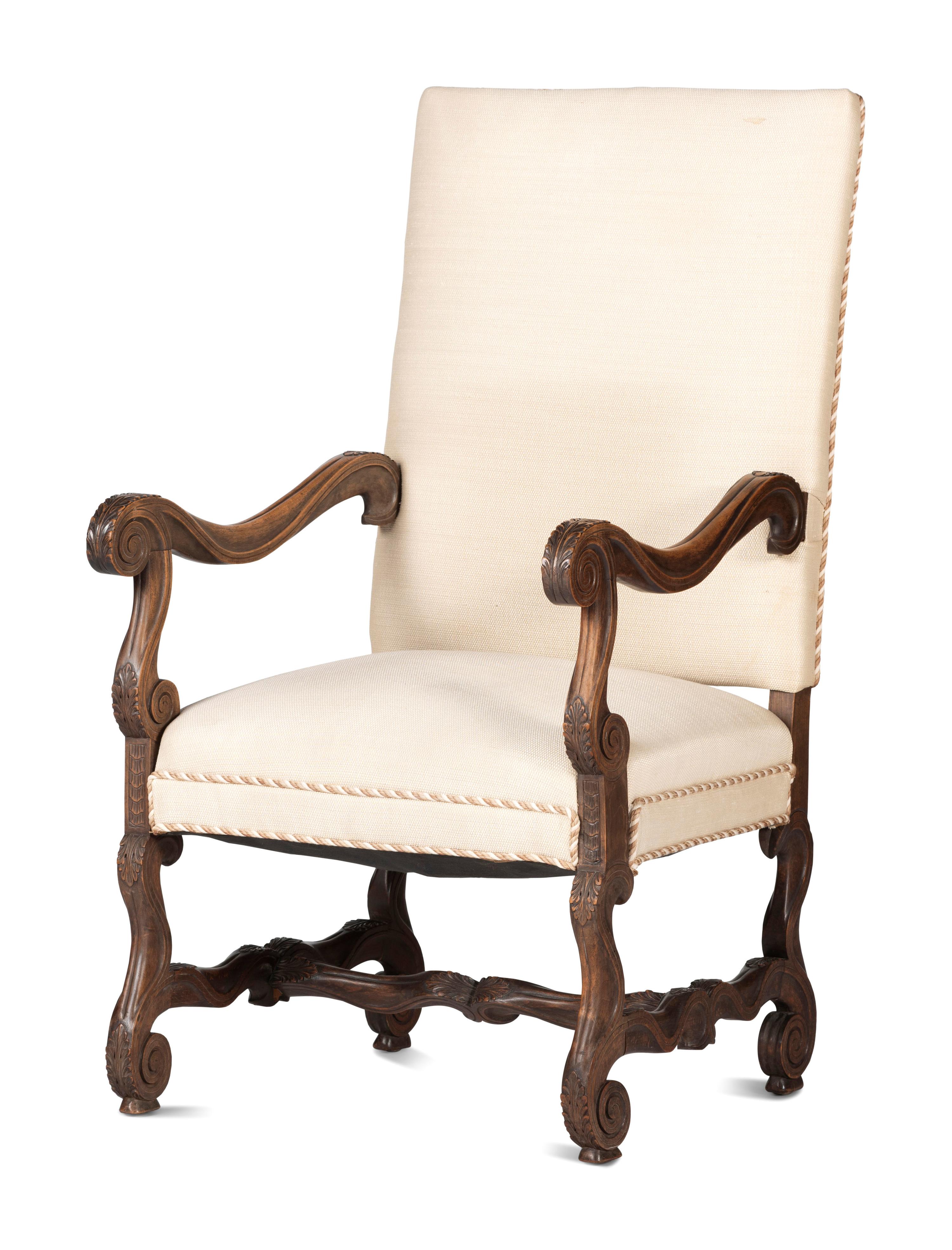 A Louis XIV Style Foliate and Scroll Carved Walnut Upholstered Fauteuil